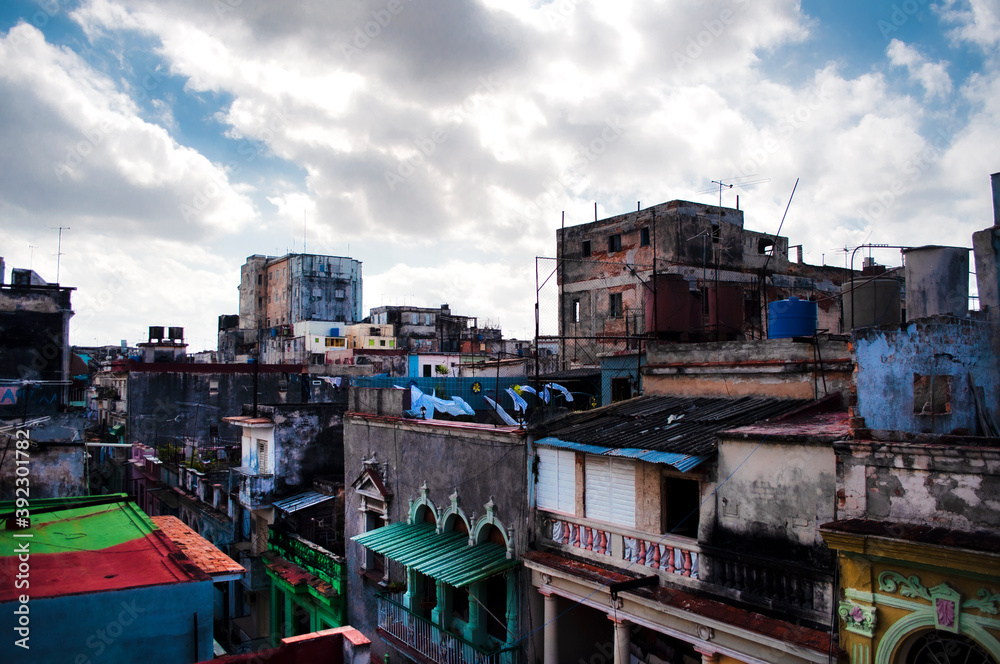 Aerial panoramic view of an old and destroyed city where there are houses and people live. Havana