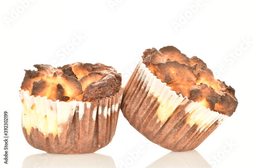 Several fragrant chocolate curd muffins, close-up, isolated on white.