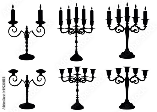 Candles with a candlestick in a set. Vector image.