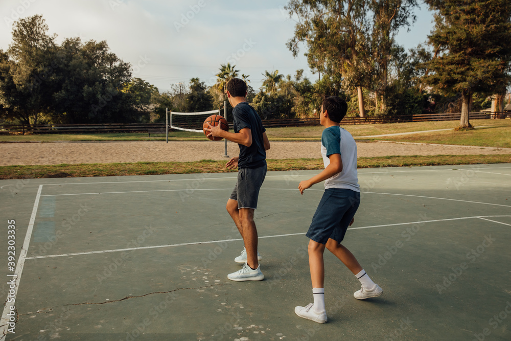 Teens Play Basketball