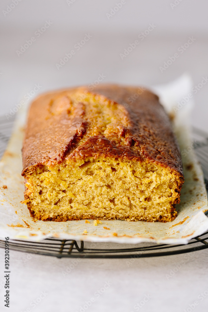 Syrup cake loaf on cooling rack, sliced open Syrup cake loaf on cooling rack, sliced open