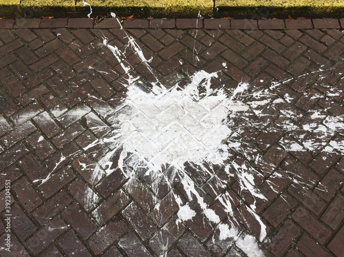 blotch of white paint on street