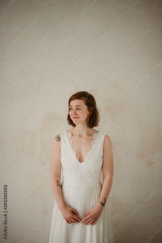Sensual young tattooed bride in trendy wedding gown Sensual young tattooed bride in trendy wedding gown