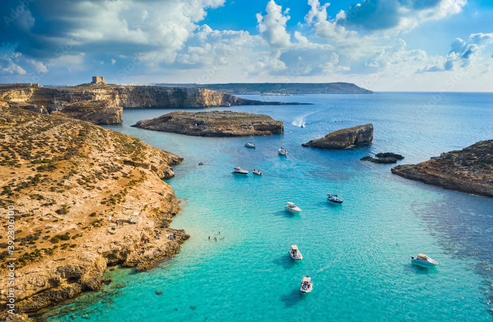 Aerial view of Comino island, Blue lagoon and boats. Malta country