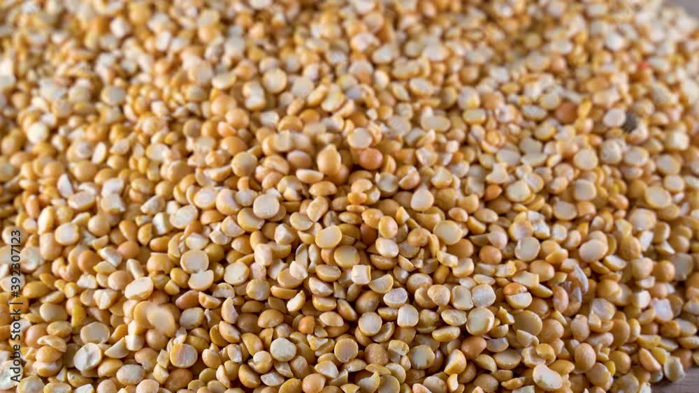 Yellow peas fall on top of the table. High-protein legumes, beans and lentils for a healthy diet Yellow peas fall on top of the table. High-protein legumes, beans and lentils for a healthy diet