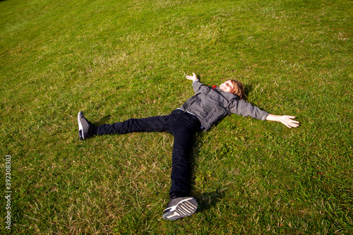 Boy laying on the grass