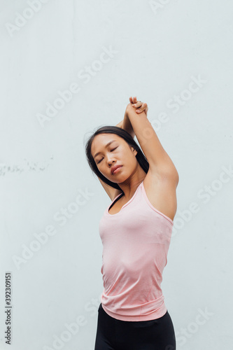 Sportswoman Stretching her Body