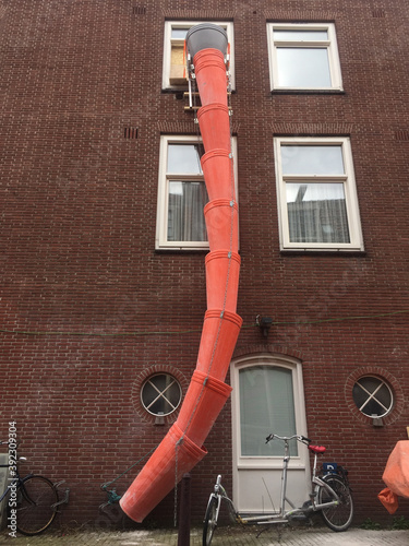 orange tubes outside house to eliminate debris
