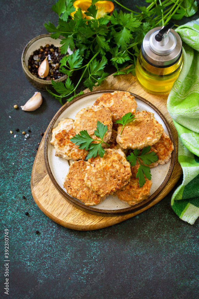 Healthy vegan food. Red fish cutlets on a dark stone or slate table. Copy space.