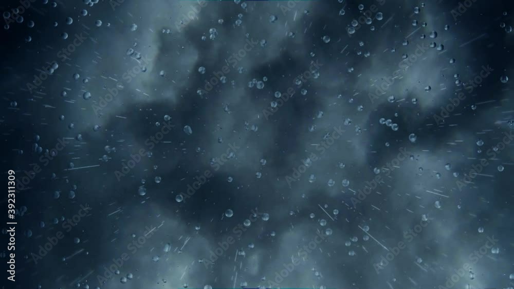 A gloomy moving background with dark stormy clouds hovering heavily in the sky with rain falling down directly onto a glass plane creating droplets clinging onto glass pane.