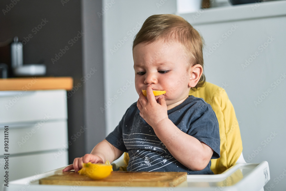 Toddler trying lemon for the first time. Toddler trying lemon for the first time.