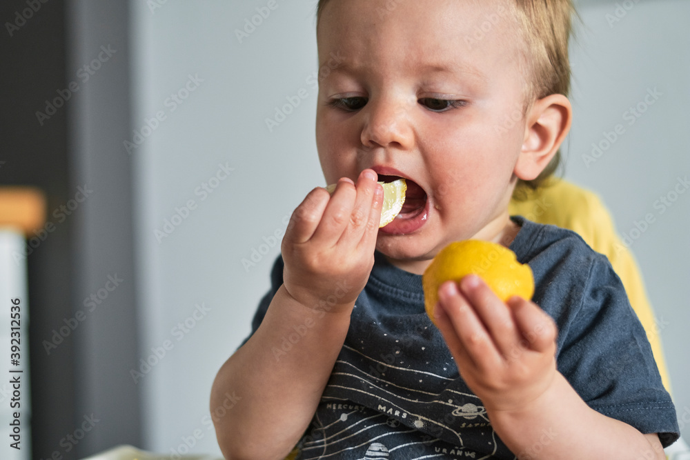 Toddler trying lemon for the first time. Toddler trying lemon for the first time.