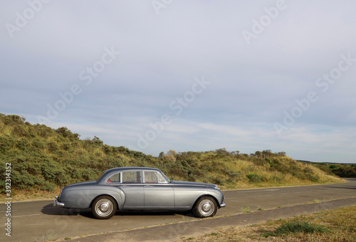classic car parked at dunes