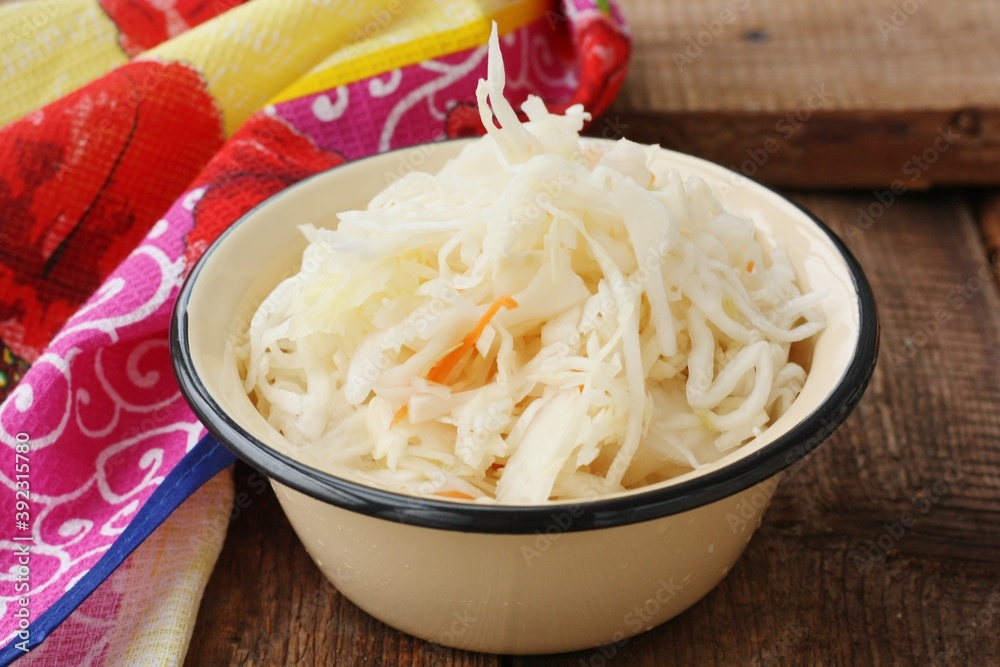 Sauerkraut with carrots on the table macro Sauerkraut with carrots on the table macro