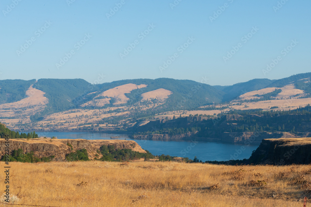 Landscape on river, hills, cliffs and trees