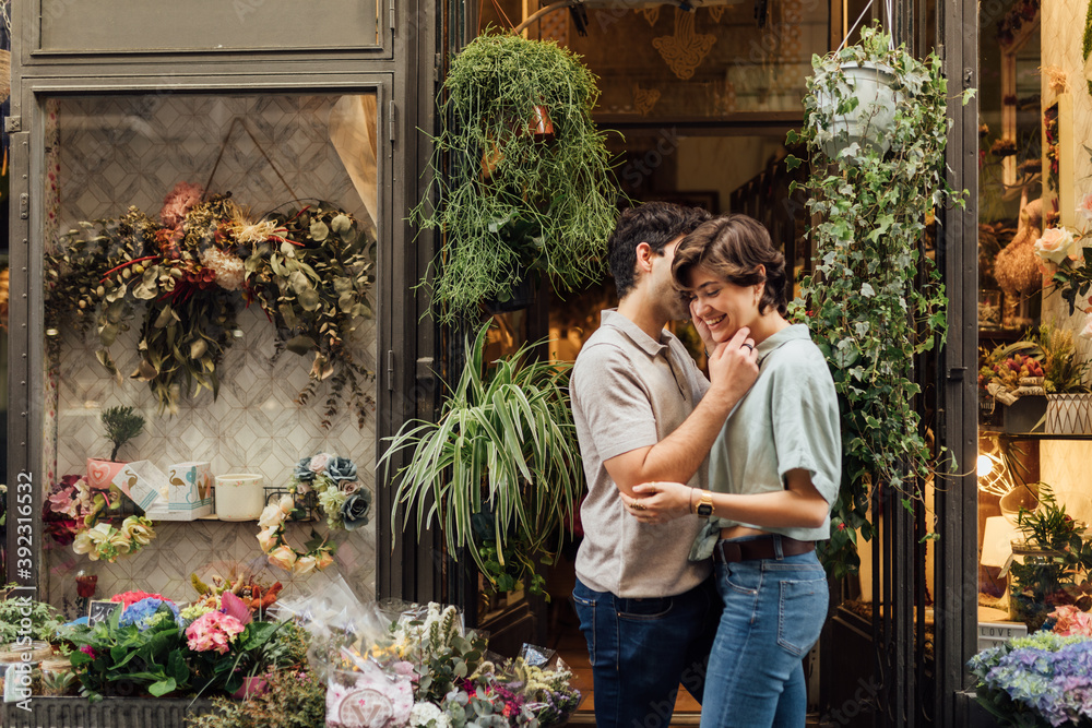 Couple on a date stopping in front of a florist Couple on a date stopping in front of a florist