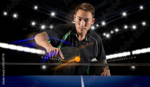 Man playing tennis on dark photo