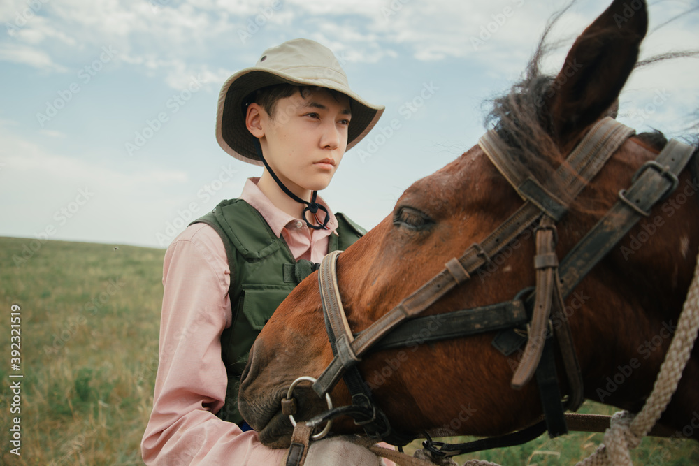 Portrait of an Asian guy with a brown horse Portrait of an Asian guy with a brown horse