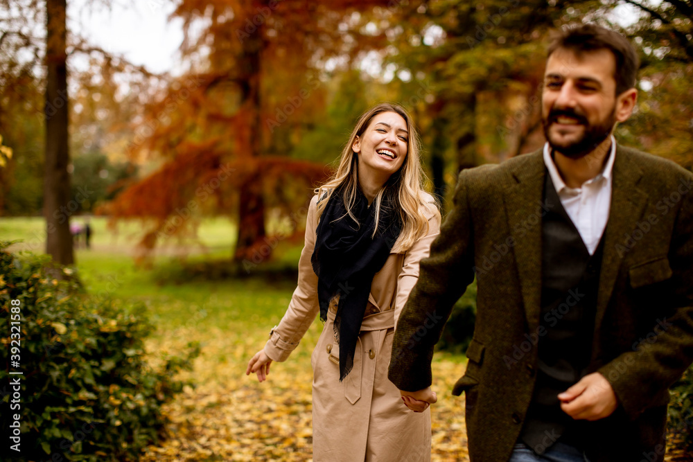 Young couple walking in the autumn park Young couple walking in the autumn park