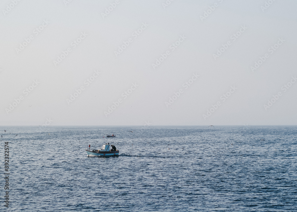 Fishing Boat in the middle of the Sea Fishing Boat in the middle of the Sea