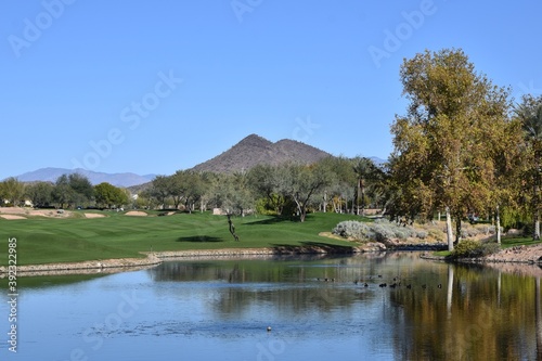 Scenic view of a golf course in Peoria Arizona with mountain in the background