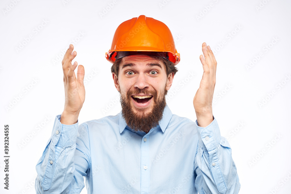 Cheerful male orange hard hat safety professional construction engineer