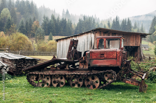 old tracked skidder in the village