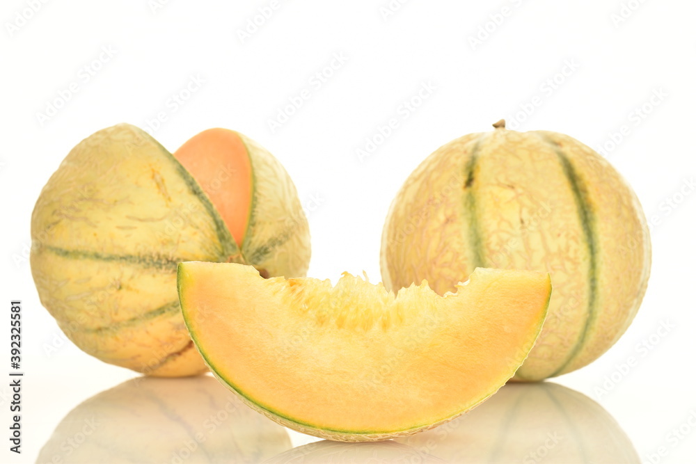  fragrant organic melons, close-up, on a white background.