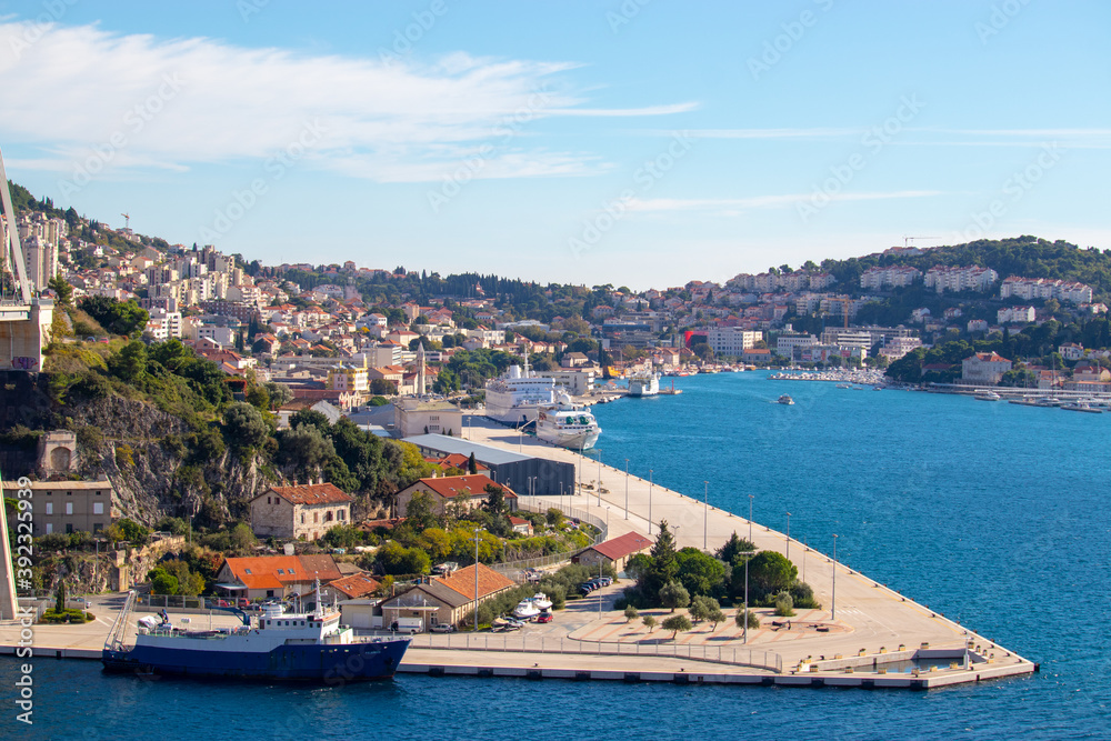 Dubrovnik Croatia October 2020 Panorama of the bay area of Dubrovnik city, entrence to the town in front of the massive bridge. Sunny warm day with bright blue sea