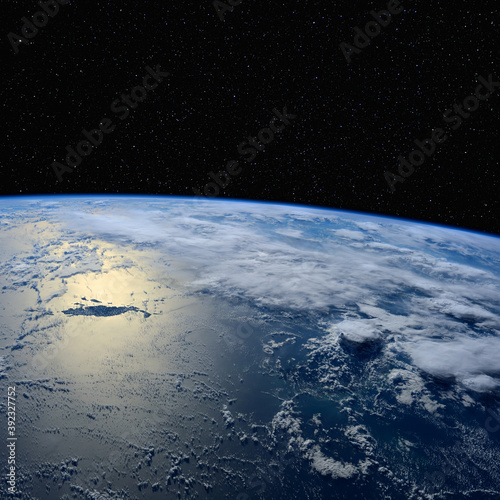 Fototapeta Naklejka Na Ścianę i Meble -  Sunlight reflects off the ocean. Elements of this image furnished by NASA.