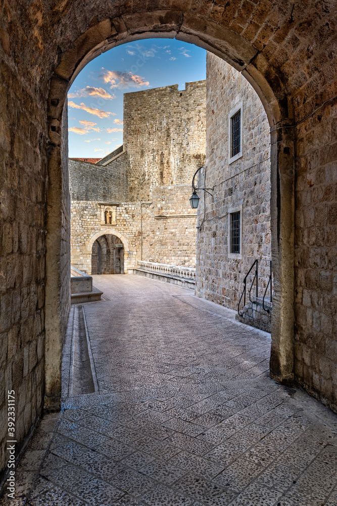An arch leading into an alleyway in the old town Dubrovnik Croatia, Europe
