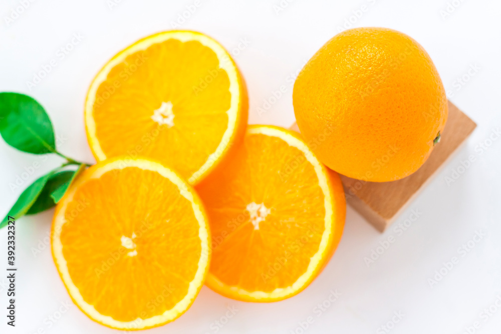 Cut orange on a white background. Natural orange fruit with cut slices. Vitamin C. Cut orange on a white background. Natural orange fruit with cut slices. Vitamin C.