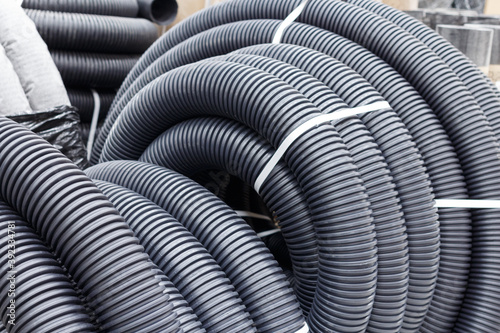 Corrugated drainage pipe of black color made of polyethylene of low pressure  diameter 110 mm. For the device of a closed drainage system.