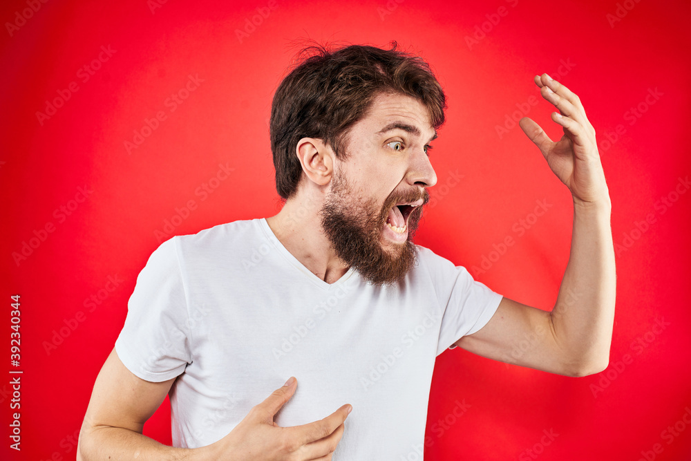 man in t-shirt gesturing with his hands dissatisfaction studio red uniform man in t-shirt gesturing with his hands dissatisfaction studio red uniform