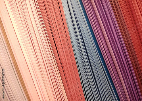 Abstract background made of colourful rows of cardboard papers. Set of colored cardboards