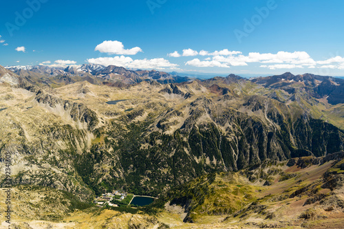 View of the Baths of Panticosa from the way up to Garmo Negro, with the Bacias peak and Brazatos mountain lake and the Monte Perdido massif in the background