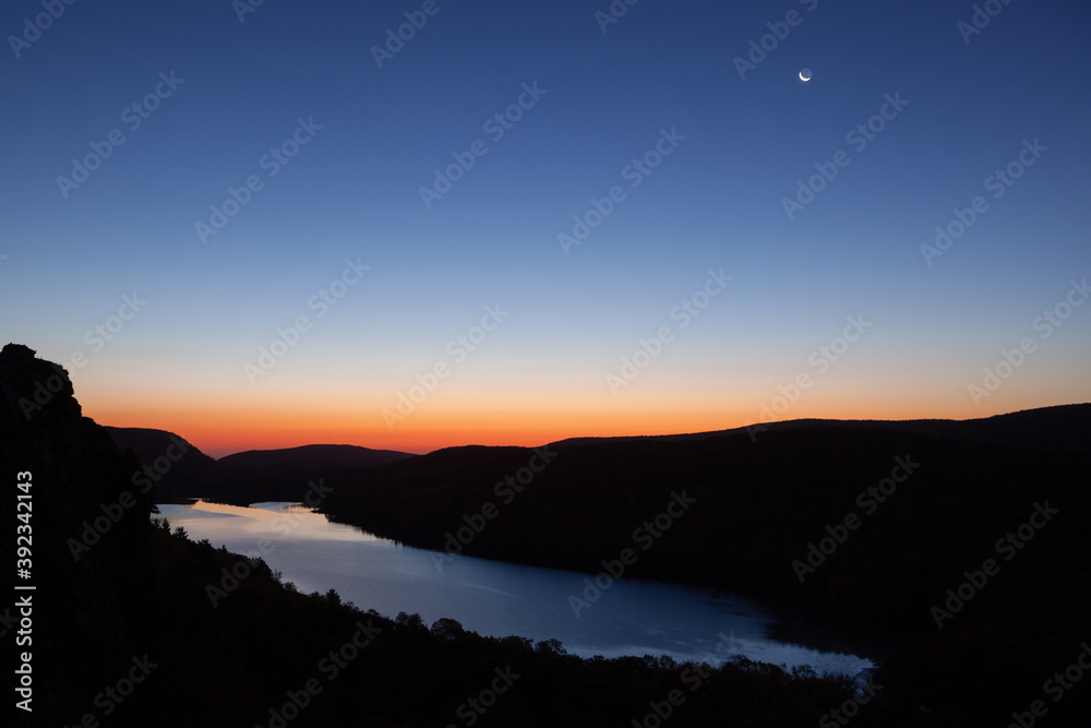 Autumn landscape at dawn with crescent moon, Lake of the Clouds, Porcupine Mountains Wilderness State Park, Michigan's Upper Peninsula, USA