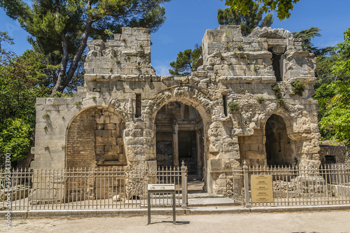 Temple of Diana (Temple de Diane, first or second century) was part of Roman sacred complex but it was not a temple, rather it was a library. Nimes, Occitanie region of southern France. photo