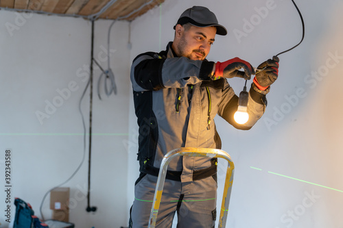 the electrician connected the wires to each other and the lamp in the socket lit up with a bright light.