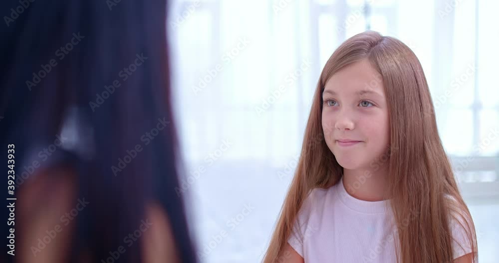 Portrait, a beautiful little girl looks at her mother and smiles. Happy childhood, family values. 4k, ProRes Portrait, a beautiful little girl looks at her mother and smiles. Happy childhood, family values. 4k, ProRes