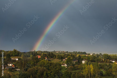 Rainbow above the rural Serbian landscape