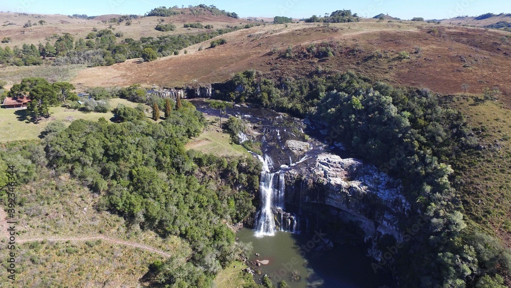 Princesa dos Campos Waterfall - Jaquirana - Rio Grande do Sul. Aerial view of a beautiful waterfall among natural fields