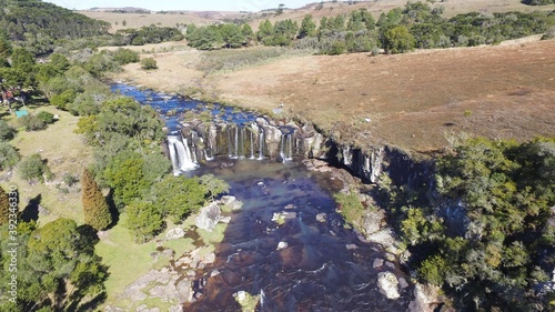 Princesa dos Campos Waterfall - Jaquirana - Rio Grande do Sul. Aerial view of a beautiful waterfall among natural fields photo