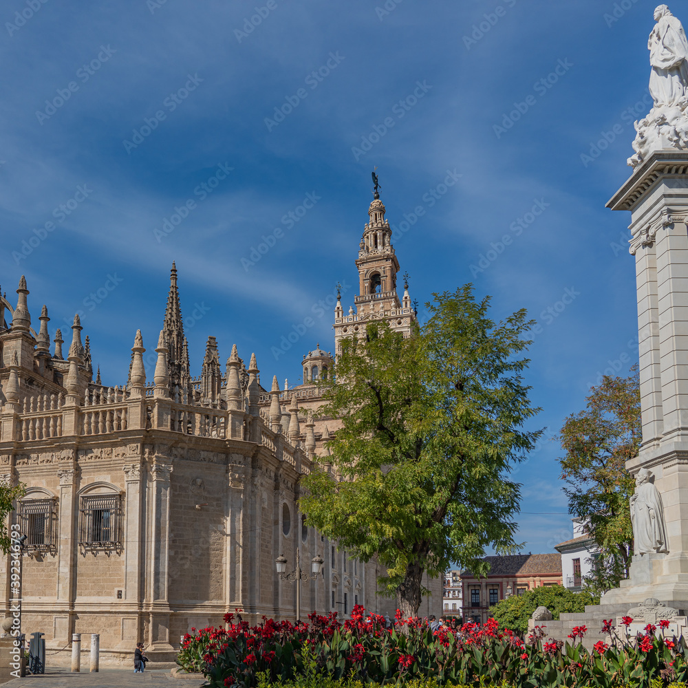 Plaza del Triunfo at the Cathedral of Saint Mary of the See in Seville, Gothic cathedral, with the skulpture Plaza del Triunfo at the Cathedral of Saint Mary of the See in Seville, Gothic cathedral, with the skulpture