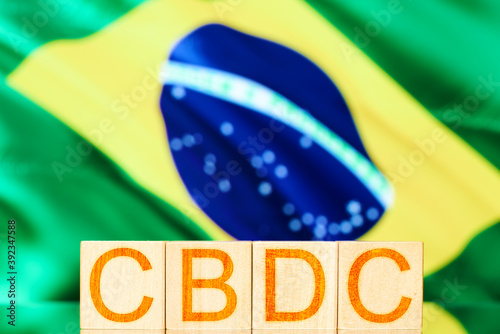 cbdc brazil. wooden cubes with the inscription cbdc on the background of the national flag of brazil photo