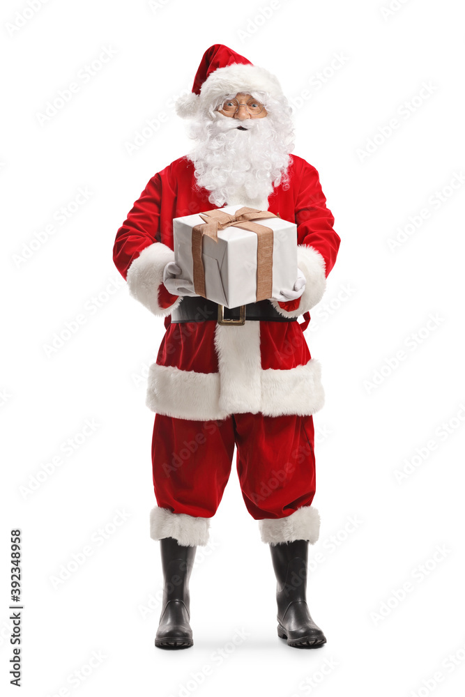 Full length portrait of Santa claus holding a big present box Full length portrait of Santa claus holding a big present box