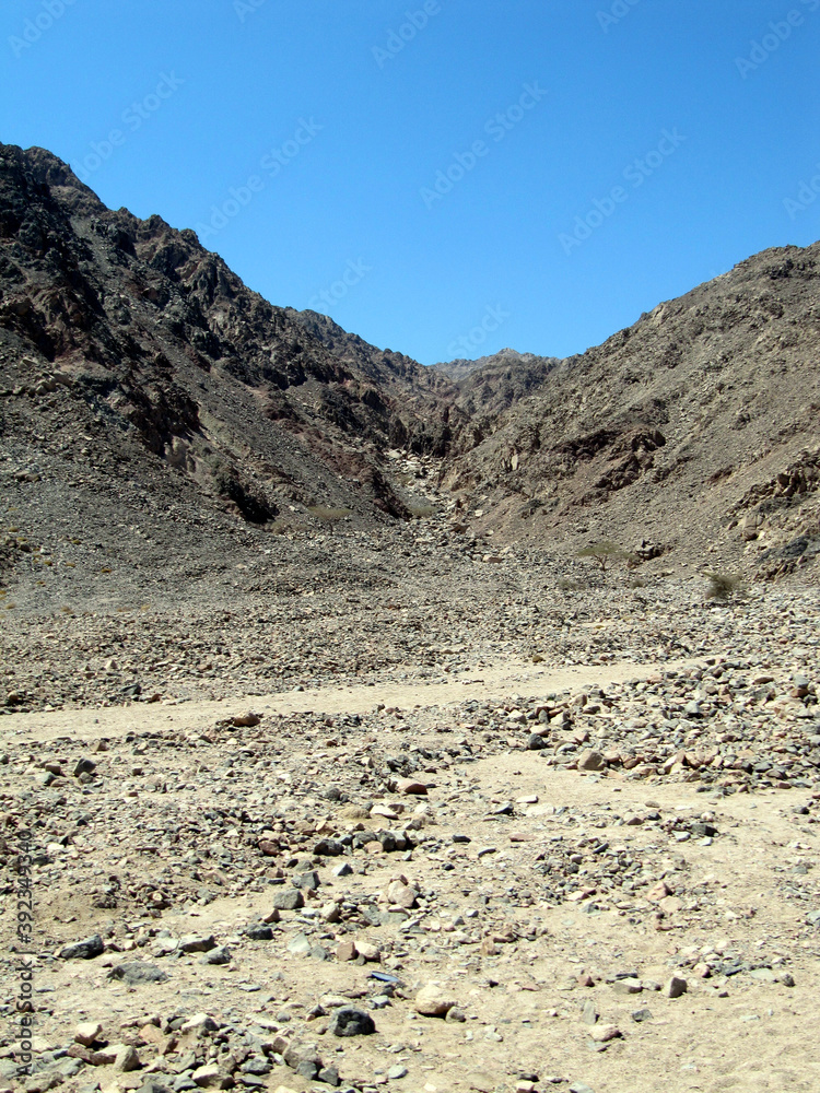 Blue sky over the Sinai mountains and rocky plateau