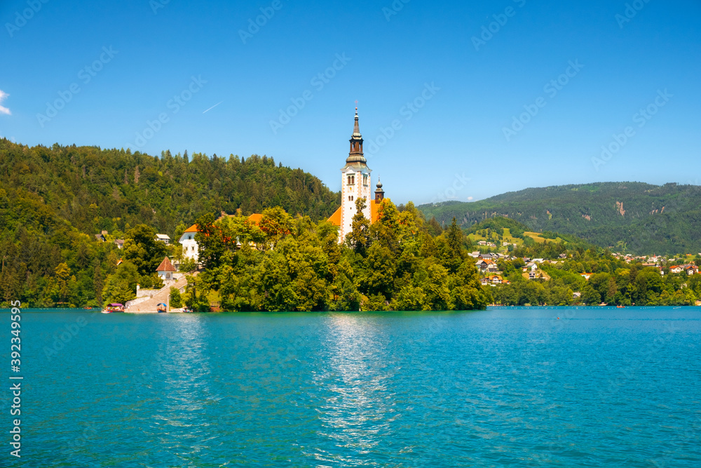 Naklejka premium Cozy Lake Bled in summer with the Juliet Alps in the background of the beautiful castle