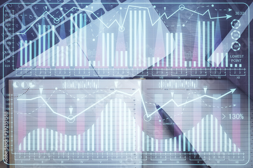 Stock market graph and top view computer on the table background. Multi exposure. Concept of financial education. © peshkova