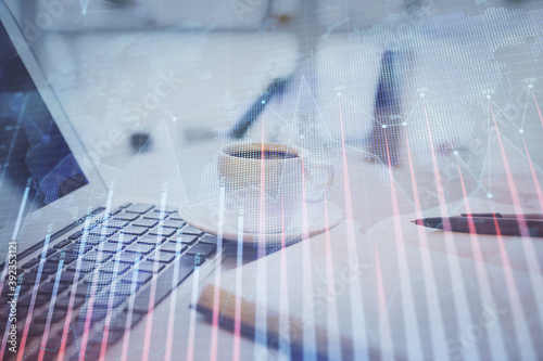 Double exposure of financial chart drawing and desktop with coffee and items on table background. Concept of forex market trading